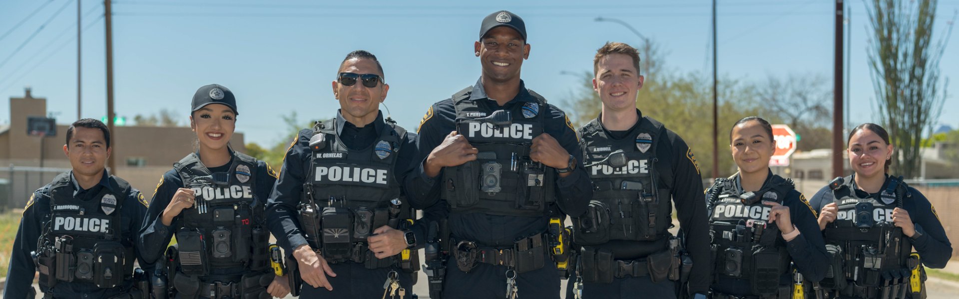 Officers standing smiling